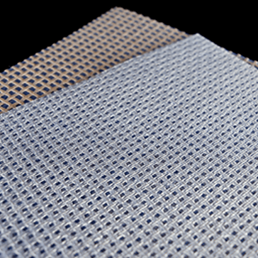 Close-up of perforated woven mesh sheets